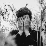 man, young, nature, teen, reeds, grass, field, country, portrait, depression, fear, loss, grief, sorrow, crying, tears, melancholy, forest, deadwood, hands